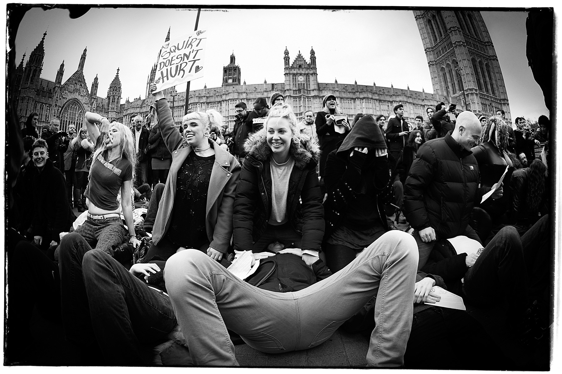 Face-sitting protest outside parliament against sexist porn law. Palace of Westminster, London 2014. Ginger Liu #Photography